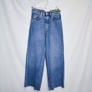 High-waisted mid-wash denim jeans